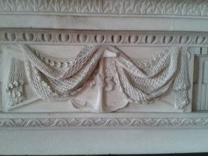 Carved fireplace in today's entrance hall. The anchor and fishing nets thought to be an attempt to link the family with Francis Drake (PHO3375)