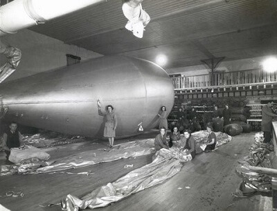 1940s photo of kite and convoy balloons being made on the maple dancefloor