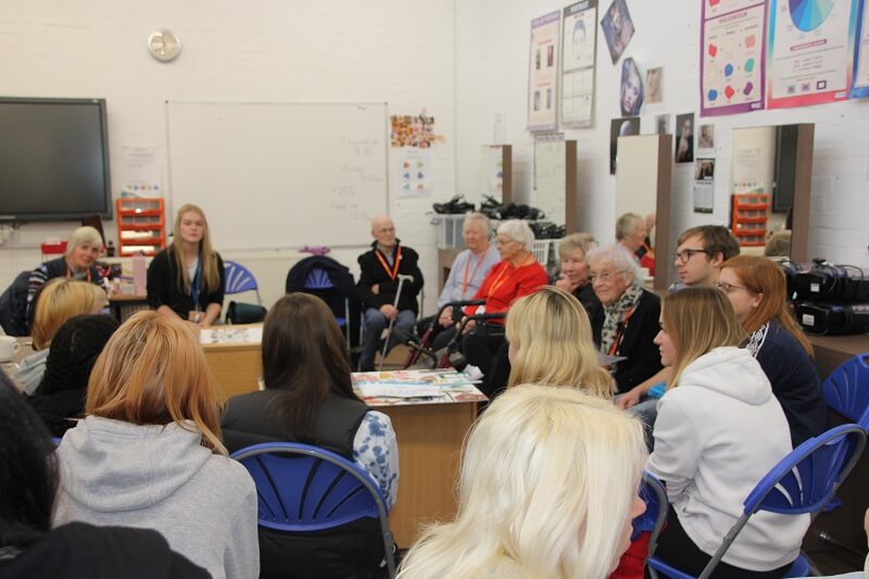 Buckinghamshire College students and staff meeting members of Amersham Museum's reminiscence group to discuss the project