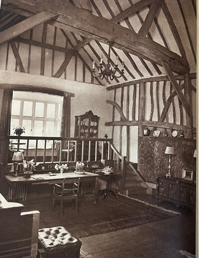 The interior of Manor Barn showing the raised ‘stage’ below the bay window, 1933