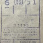 A close-up photo of an old, faded train ticket with visible numbers including “6 ORD 51” and 3256815; fare, class, and seat are indicated in printed boxes.