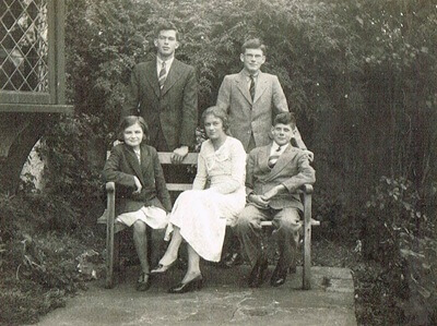 Audrey Brown with Tim, Robin. John and her youngest daughter in the garden of Little Croft