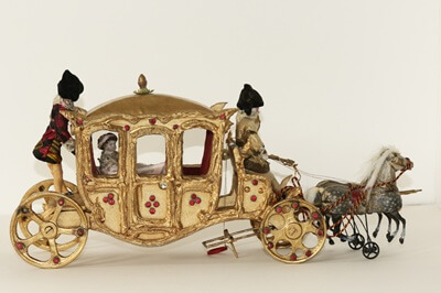 Cinderella’s coach taking Cinderella to the Ball with a footman, coachman and horses