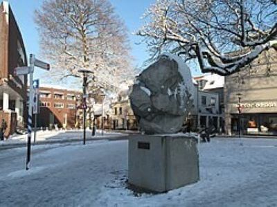 Town scene with modern stone sculpture