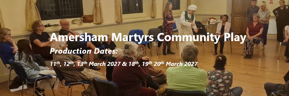A group of people sitting in a circle in a community hall during a rehearsal for the Amersham Martyrs Community Play, with production dates listed as 11th, 12th, 13th, 18th and 19th March 2027.